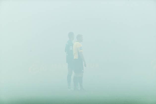Pyrotechnics Hansa fans south stand fogged pitch interruption left goalkeeper Benjamin Uphoff Rostock with referee Timo Gansloweit GER, FC Hansa Rostock vs FC Energie Cottbus, Football, Men, 3 Liga, 09 Matchday, Season 2025 2026, 30 09 2025 Rostock Ostseestadion Mecklenburg Vorpommern Germany