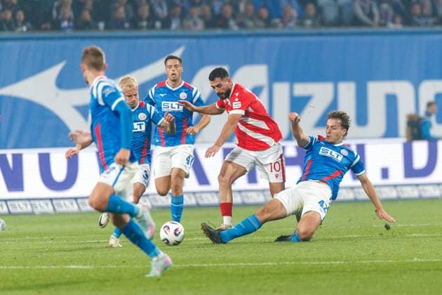from l Viktor Bergh Rostock , Tolcay Cigerci FCE and Benno Dietze Rostock GER, FC Hansa Rostock vs FC Energie Cottbus, Football, Men, 3 Liga, Matchday 09, Season 2025 2026, 30 09 2025 Rostock Ostseestadion Mecklenburg Vorpommern Germany