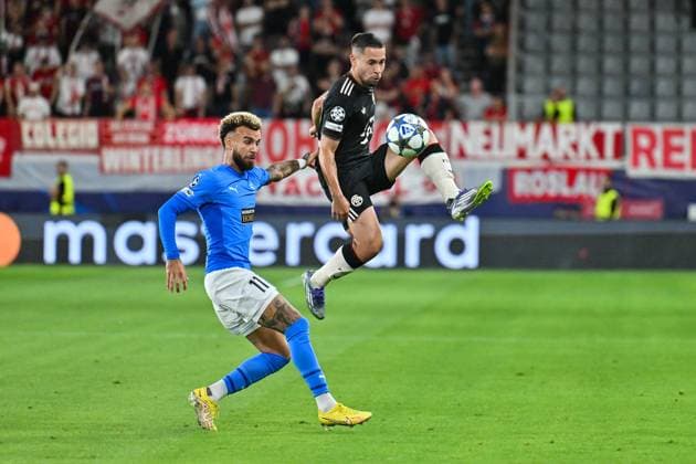 UEFA Champions League Paphos FC FC Bayern Munich 30 09 2025 in duel JAJA Paphos FC 11 and Raphael GUERREIRO FC Bayern Muenchen 22 duel UEFA Champions League Paphos FC FC Bayern Munich Alphamega Stadium on 30 09 2025 Copyright: xBEAUTIFULxSPORTS Goldbergx