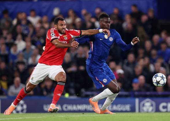 London, England, 30th September 2025. Benoit Badiashile of Chelsea with Vangelis Pavlidis of Benfica during the Chelsea vs Benfica UEFA Champions League match at Stamford Bridge, London. Picture credit should read: David Klein Sportimage EDITORIAL USE ONLY. No use with unauthorised audio, video, data, fixture lists, club league logos or live services. Online in-match use limited to 120 images, no video emulation. No use in betting, games or single club league player publications. SPI_010_DK_Chelsea_Benfica SPI-4176-0010