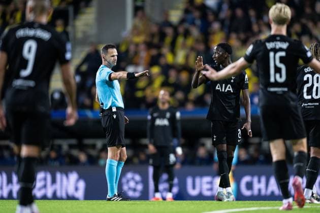 250930 Referee Ivan Kruzliak and Pape Matar Sarr of Tottenham Hotspur during the UEFA Champions League football match between Bodo Glimt and Tottenham on September 30, 2025 in Bodo Photo Marius Simensen BILDBYRAN COP 238 MM0044 bbeng football fotball soccer uefa champions league mesterligaen bodo glimt tottenham hotspur spurs  Copyright: MARIUSxSIMENSEN BB250930BB948