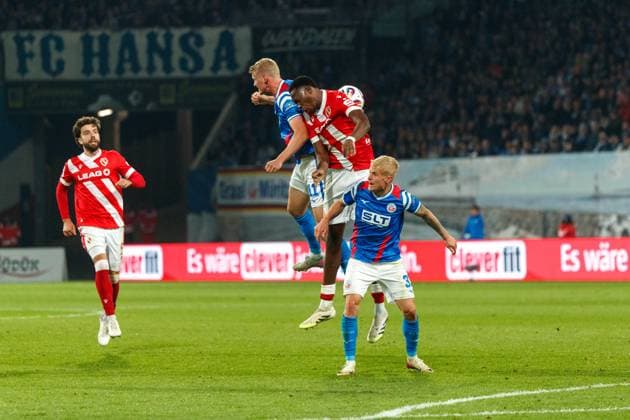 from l Emil Frost Holten Rostock , King Manu FCE and Viktor Bergh Rostock GER, FC Hansa Rostock vs FC Energie Cottbus, Football, Men, 3 Liga, Matchday 09, Season 2025 2026, 30 09 2025 Rostock Ostseestadion Mecklenburg Vorpommern Germany