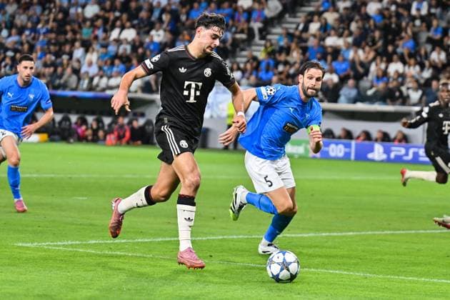 UEFA Champions League Paphos FC FC Bayern München 30 09 2025 in duel Aleksandar PAVLOVIC FC Bayern Muenchen 45 and David GOLDAR Paphos FC 5 duel UEFA Champions League Paphos FC FC Bayern München Alphamega Stadium on 30 09 2025 Copyright: xBEAUTIFULxSPORTS Goldbergx