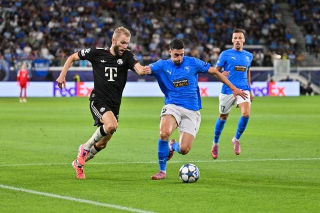 UEFA Champions League Paphos FC FC Bayern Munich 30 09 2025 in duel Konrad LAIMER FC Bayern Muenchen 27 and Kostas PILEAS Paphos FC 2 duel UEFA Champions League Paphos FC FC Bayern Munich Alphamega Stadium on 30 09 2025 Copyright: xBEAUTIFULxSPORTS Goldbergx