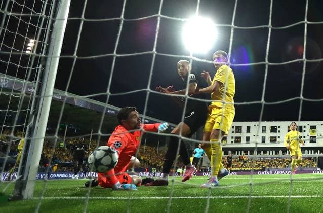 Jostein Gundersen of Bodo Glimt scores an own goal under pressure from Richarlison of Tottenham Hotspur FK Bodo Glimt v Tottenham Hotspur, UEFA Champions League, Group Stage, Football, Aspmyra Stadion, Bodo, Norway - 30 Sep 2025Bodo Aspmyra Stadion Norway EDITORIAL USE ONLY No use with unauthorised audio, video, data, fixture lists, club league logos or live services. Online in-match use limited to 120 images, no video emulation. No use in betting, games or single club league player publications.  Copyright: xMichaelxZemanek Shutterstockx 15504026au