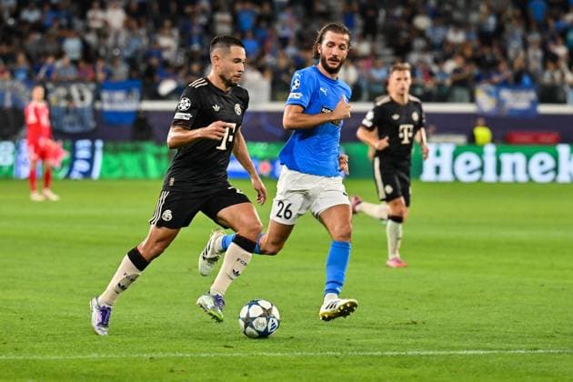 UEFA Champions League Paphos FC FC Bayern München 30 09 2025 in duel Raphael GUERREIRO FC Bayern Muenchen 22 and Ivan SUNJIC Paphos FC 26 duel UEFA Champions League Paphos FC FC Bayern München Alphamega Stadium on 30 09 2025 Copyright: xBEAUTIFULxSPORTS Goldbergx