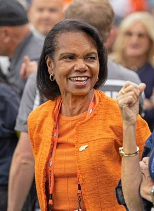 September 30, 2025, Denver, Colorado, USA: A part owner of the Broncos CONDOLEEZA RICE chats on the sideline before the start of the 1st. Half at Empower Field at Mile High Monday night. Broncos beat the Bengals 28-3. Denver USA - ZUMAav4_ 20250930_zaf_av4_012 Copyright: xHectorxAcevedox