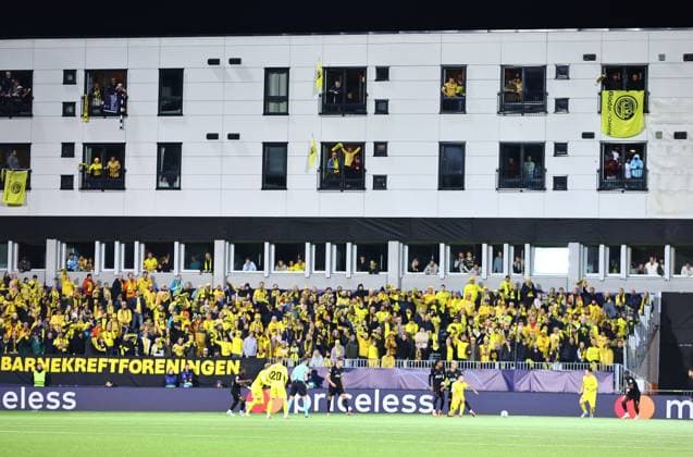 Fans of Bodo Glimt watching from a stadiums building windows FK Bodo Glimt v Tottenham Hotspur, UEFA Champions League, Group Stage, Football, Aspmyra Stadion, Bodo, Norway - 30 Sep 2025Bodo Aspmyra Stadion Norway EDITORIAL USE ONLY No use with unauthorised audio, video, data, fixture lists, club league logos or live services. Online in-match use limited to 120 images, no video emulation. No use in betting, games or single club league player publications.  Copyright: xMichaelxZemanek Shutterstockx 15504026bb