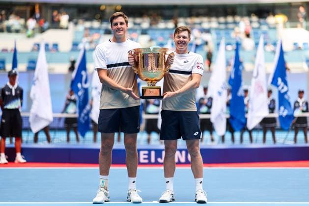 BEIJING, CHINA - OCTOBER 01: Henry Patten of Great Britain and Harri Heliovaara of Finland pose with the trophy during the medal ceremony following the Men s Doubles Final match against Karen Khachanov and Andrey Rublev on day 10 of the 2025 China Open at the National Tennis Center on October 1, 2025 in Beijing, China.  Copyright: xVCGx 111594379397