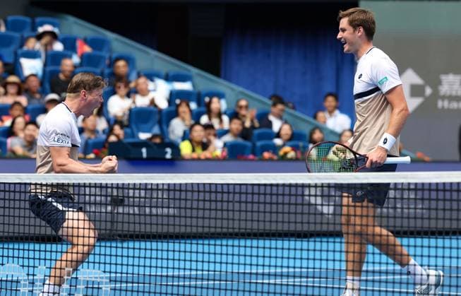 (251001) -- BEIJING, Oct. 1, 2025 -- Harri Heliovaara(L) Henry Patten celebrate after winning the men s doubles final match between Harri Heliovaara(Finland) Henry Patten (Britain) and Karen Khachanov Andrey Rublev of Russia at 2025 China Open tennis tournament in Beijing, China, Oct. 1, 2025. ) (SP)CHINA-BEIJING-TENNIS-CHINA OPEN-MEN S DOUBLES-FINAL(CN) DuxXinyi 