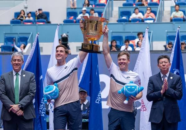 (251001) -- BEIJING, Oct. 1, 2025 -- Harri Heliovaara(2nd R) Henry Patten (2nd L) pose with their trophy during the award ceremony for the men s doubles final match between Harri Heliovaara(Finland) Henry Patten (Britain) and Karen Khachanov Andrey Rublev of Russia at 2025 China Open tennis tournament in Beijing, China, Oct. 1, 2025. ) (SP)CHINA-BEIJING-TENNIS-CHINA OPEN-MEN S DOUBLES-FINAL(CN) HuxJingwen 