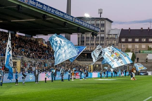 The flag wavers in front of the standing room GER, TSV 1860 Muenchen vs Viktoria Koeln 1904, Football, 3 Bundesliga, Matchday 9, Season 2025 2026, 01 10 2025 DFL DFB REGULATIONS PROHIBIT ANY USE OF PHOTOGRAPHS as IMAGE SEQUENCES and or QUASI VIDEO GER, TSV 1860 Muenchen vs Viktoria Koeln 1904, Football, 3 Bundesliga, Matchday 9, Season 2025 2026, 01 10 2025 Muenchen Copyright: xEibner-Pressefoto HeikexFeinerx EP_HFR
