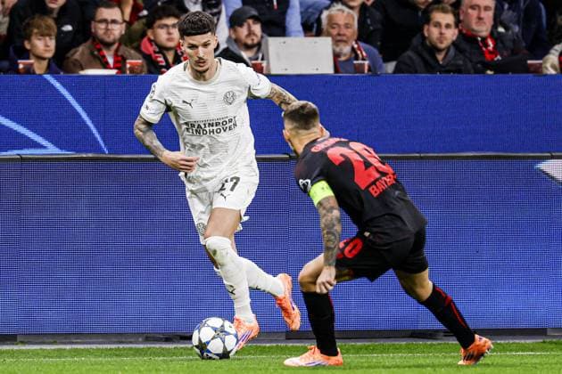 Dennis Man of PSV Eindhoven battles for possession with Alejandro Grimaldo of Bayer 04 Leverkusen Bayer 04 Leverkusen v PSV Eindhoven, UEFA Champions League 2025 26 League Phase MD2, Bayer 04 Leverkusen v PSV Eindhoven, BayArena, October 1, 2025, Leverkusen, Germany.
