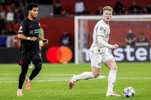 Jerdy Schouten of PSV Eindhoven battles for possession with Malik Tillman of Bayer 04 Leverkusen Bayer 04 Leverkusen v PSV Eindhoven, UEFA Champions League 2025 26 League Phase MD2, Bayer 04 Leverkusen v PSV Eindhoven, BayArena, October 1, 2025, Leverkusen, Germany.