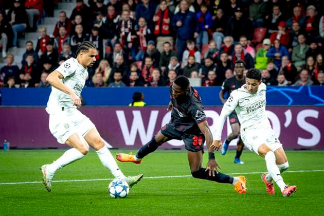 Bayer 04 Leverkusen forwarder Christian Kofane, PSV Eindhoven defender Mauro Junior during the match Bayer 04 Leverkusen vs PSV Eindhoven at the Bay Arena for the Champions League - League phase - Matchday 2 season 2025-2026 in LEVERKUSEN, Germany on 20 september 2025, (photo by Marcel van Dorst EYE4images DeFodi Images) Bayer 04 Leverkusen forwarder Christian Kofane, PSV Eindhoven defender Mauro Junior during the match Bayer 04 Leverkusen vs PSV Eindhoven at the Bay Arena for the Champions League League phase Matchday 2 season 2025 2026 in LEVERKUSEN, Germany on 20 september 2025, photo by Marcel van Dorst EYE4images DeFodi Images