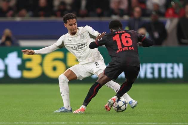 Anass Salah-Eddine (PSV Eindhoven) und Axel Tape (Bayer 04 Leverkusen) battle for the ball during the UEFA Champions League 2025 26 League Phase MD2 match between Bayer 04 Leverkusen and PSV Eindhoven at BayArena on October 1, 2025 in Leverkusen, Germany. (Photo by Oliver Kaelke DeFodi Images) Anass Salah Eddine PSV Eindhoven and Axel Tape Bayer 04 Leverkusen battle for the ball during the UEFA Champions League 2025 26 League Phase MD2 match between Bayer 04 Leverkusen and PSV Eindhoven at BayArena on October 1, 2025 in Leverkusen, Germany Photo by Oliver Kaelke DeFodi Images