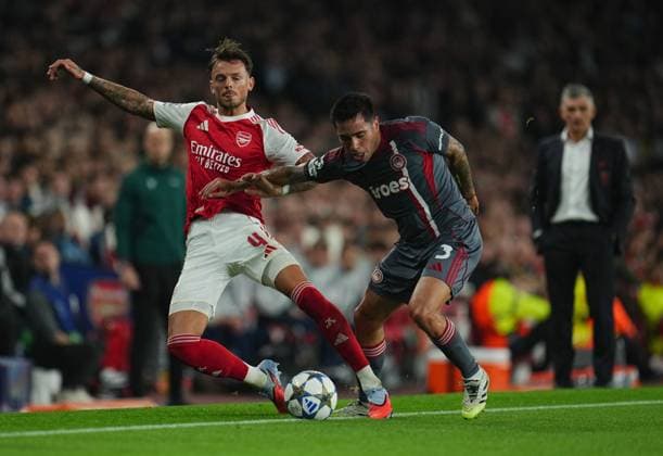 Ben White of Arsenal is pushed by Francisco Ortega of Olympiakos Arsenal v Olympiakos, UEFA Champions League, Group Stage, Football, Emirates Stadium, London, UK - 01 Oct 2025London Emirates Stadium United Kingdom EDITORIAL USE ONLY No use with unauthorised audio, video, data, fixture lists, club league logos or live services. Online in-match use limited to 120 images, no video emulation. No use in betting, games or single club league player publications. Copyright: xJoexToth Shutterstockx 15504044ai