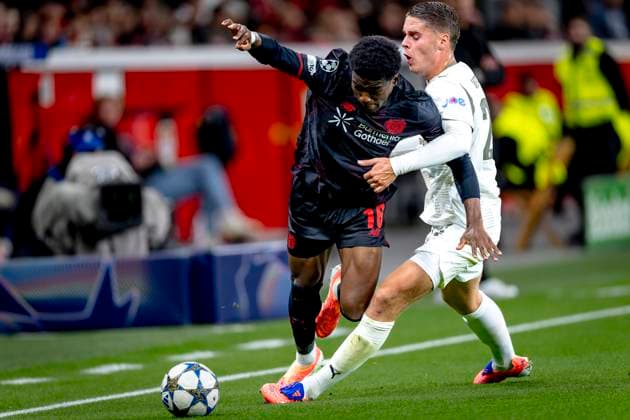 Bayer 04 Leverkusen defender Axel Tape, PSV Eindhoven midfielder Joey Veerman during the match Bayer 04 Leverkusen vs PSV Eindhoven at the Bay Arena for the Champions League - League phase - Matchday 2 season 2025-2026 in LEVERKUSEN, Germany on 20 september 2025, (photo by Marcel van Dorst EYE4images DeFodi Images) Bayer 04 Leverkusen defender Axel Tape, PSV Eindhoven midfielder Joey Veerman during the match Bayer 04 Leverkusen vs PSV Eindhoven at the Bay Arena for the Champions League League phase Matchday 2 season 2025 2026 in LEVERKUSEN, Germany on 20 september 2025, photo by Marcel van Dorst EYE4images DeFodi Images