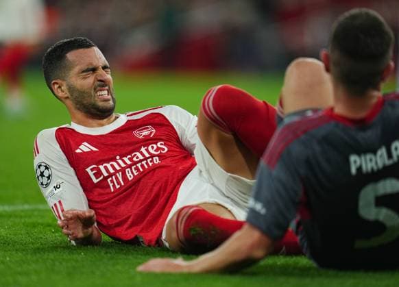 Mikel Merino of Arsenal reacts after a collision with Lorenzo Pirola of Olympiakos Arsenal v Olympiakos, UEFA Champions League, Group Stage, Football, Emirates Stadium, London, UK - 01 Oct 2025London Emirates Stadium United Kingdom EDITORIAL USE ONLY No use with unauthorised audio, video, data, fixture lists, club league logos or live services. Online in-match use limited to 120 images, no video emulation. No use in betting, games or single club league player publications. Copyright: xJoexToth Shutterstockx 15504044am