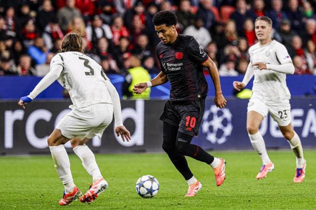 Malik Tillman of Bayer 04 Leverkusen battles for possession with Yarek Gasiorowski of PSV Eindhoven Bayer 04 Leverkusen v PSV Eindhoven, UEFA Champions League 2025 26 League Phase MD2, Bayer 04 Leverkusen v PSV Eindhoven, BayArena, October 1, 2025, Leverkusen, Germany.