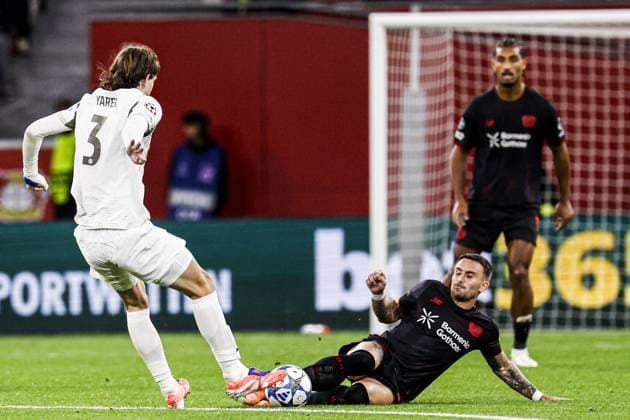 Aleix Garcia of Bayer 04 Leverkusen battles for possession with Yarek Gasiorowski of PSV Eindhoven Bayer 04 Leverkusen v PSV Eindhoven, UEFA Champions League 2025 26 League Phase MD2, Bayer 04 Leverkusen v PSV Eindhoven, BayArena, October 1, 2025, Leverkusen, Germany.