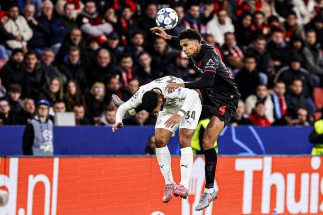 Jarell Quansah of Bayer 04 Leverkusen heads the ball with Ismael Saibari of PSV Eindhoven Bayer 04 Leverkusen v PSV Eindhoven, UEFA Champions League 2025 26 League Phase MD2, Bayer 04 Leverkusen v PSV Eindhoven, BayArena, October 1, 2025, Leverkusen, Germany.