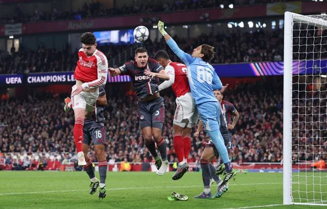 London, England, 1st October 2025. Konstantinos Tzolakis of Olympiakos saves a header from Declan Rice of Arsenal during the Arsenal vs Olympiacos UEFA Champions League match at the Emirates Stadium, London. Picture credit should read: David Klein Sportimage EDITORIAL USE ONLY. No use with unauthorised audio, video, data, fixture lists, club league logos or live services. Online in-match use limited to 120 images, no video emulation. No use in betting, games or single club league player publications. SPI_044_DK_Arsenal_Olympiakos SPI-4186-0046