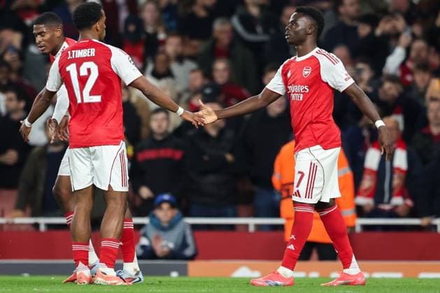 1st October 2025; Emirates Stadium, London, England; Champions League Football, Arsenal versus Olympiakos; Bukayo Saka of Arsenal celebrates scoring his sides 2nd goal of the match in the 90+2nd minute for 2-0 with Jurrien Timber of Arsenal  HenningxvonxJagow