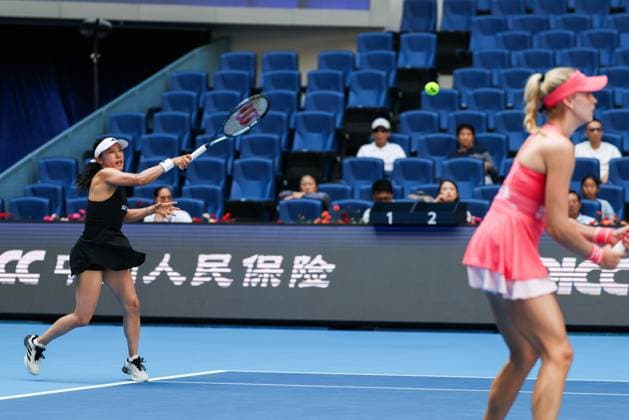 BEIJING, CHINA - OCTOBER 02: Miyu Kato of Japan and Fanny Stollar of Hungary compete in the Women s Doubles Quarterfinal match against Timea Babos of Hungary and Luisa Stefani of Brazil on day 11 of the 2025 China Open at the National Tennis Center on October 2, 2025 in Beijing, China.  Copyright: xVCGx 111594594615