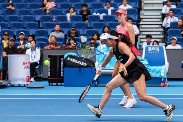BEIJING, CHINA - OCTOBER 02: Miyu Kato of Japan and Fanny Stollar of Hungary compete in the Women s Doubles Quarterfinal match against Timea Babos of Hungary and Luisa Stefani of Brazil on day 11 of the 2025 China Open at the National Tennis Center on October 2, 2025 in Beijing, China.  Copyright: xVCGx 111594596063