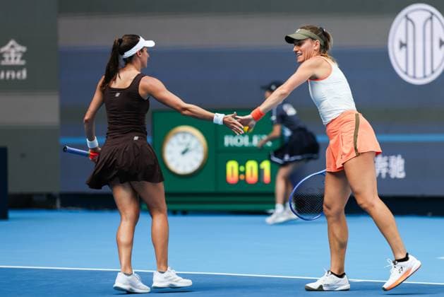 BEIJING, CHINA - OCTOBER 02: Timea Babos of Hungary and Luisa Stefani of Brazil react in the Women s Doubles Quarterfinal match against Miyu Kato of Japan and Fanny Stollar of Hungary on day 11 of the 2025 China Open at the National Tennis Center on October 2, 2025 in Beijing, China.  Copyright: xVCGx 111594593061