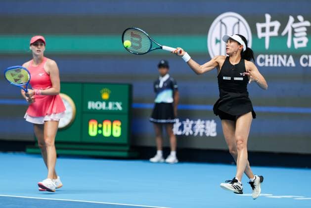 BEIJING, CHINA - OCTOBER 02: Miyu Kato of Japan and Fanny Stollar of Hungary compete in the Women s Doubles Quarterfinal match against Timea Babos of Hungary and Luisa Stefani of Brazil on day 11 of the 2025 China Open at the National Tennis Center on October 2, 2025 in Beijing, China.  Copyright: xVCGx 111594593144