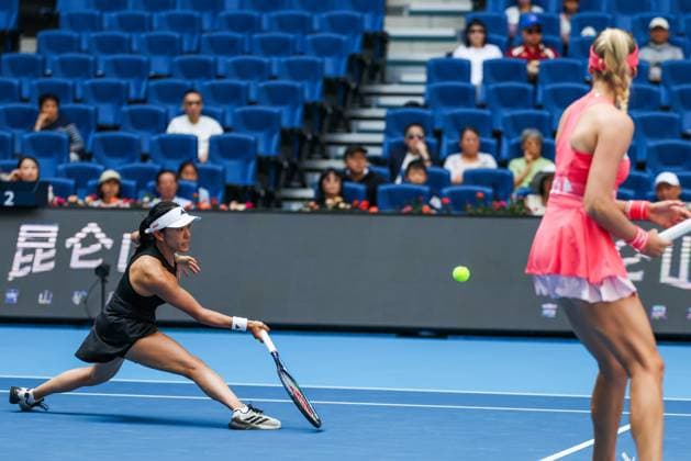 BEIJING, CHINA - OCTOBER 02: Miyu Kato of Japan and Fanny Stollar of Hungary compete in the Women s Doubles Quarterfinal match against Timea Babos of Hungary and Luisa Stefani of Brazil on day 11 of the 2025 China Open at the National Tennis Center on October 2, 2025 in Beijing, China.  Copyright: xVCGx 111594594597
