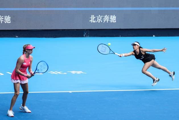 BEIJING, CHINA - OCTOBER 02: Miyu Kato of Japan and Fanny Stollar of Hungary compete in the Women s Doubles Quarterfinal match against Timea Babos of Hungary and Luisa Stefani of Brazil on day 11 of the 2025 China Open at the National Tennis Center on October 2, 2025 in Beijing, China.  Copyright: xVCGx 111594601502