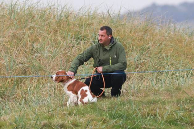 2nd October 2025; The Carnoustie Golf Links, Carnoustie, Angus, Scotland; Alfred Dunhill Links Golf Championship, Round One; A spectator and his dog watch the golf at Carnoustie Championship golf course during the first round of the Alfred Dunhill Links Championship  DavidxYoung