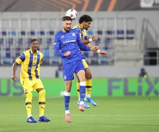 Maccabi Tel-Aviv FC and GNK Dinamo Zagreb - UEFA Europa League 2025 26 League Phase MD2 Dion Drena Beljo of GNK Dinamo Zagreb and Roy Revivo of Maccabi Tel Aviv jumps for the ball during the UEFA Europa League 2025 26 League Phase MD2 match between Maccabi Tel-Aviv FC and GNK Dinamo Zagreb at TSC Arena on October 2, 2025 in Backa Topola, Serbia.  SlobodanxSandic PIXSELL