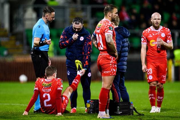 251002 Sean Gannon of Shelbourne FC receives medical attention during the UEFA Conference League football match between Shelbourne FC and Häcken on October 2, 2025 in Dublin Photo Carl Sandin BILDBYRAN kod CS CS0783 fotboll football soccer fotball uefa conference league conference league shelbourne fc häcken bbeng  Copyright: CARLxSANDIN BB251002CS076