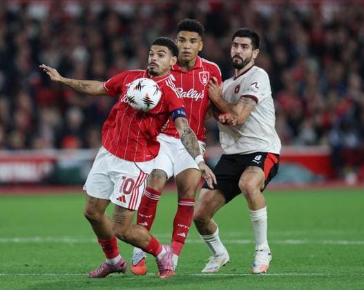 Nottingham, England, 2nd October 2025. Morgan Gibbs White of Nottingham Forest controls the ball in front of Philip Billing of FC Midtjylland during the Nottingham Forest vs FC Midtjylland UEFA Champions League match at the City Ground, Nottingham. Picture credit should read: James Baylis Sportimage EDITORIAL USE ONLY. No use with unauthorised audio, video, data, fixture lists, club league logos or live services. Online in-match use limited to 120 images, no video emulation. No use in betting, games or single club league player publications. SPI_026_JB_NOT_MID SPI-4181-0028