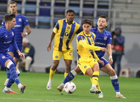 Maccabi Tel-Aviv FC and GNK Dinamo Zagreb - UEFA Europa League 2025 26 League Phase MD2 Ben Lederman of Maccabi Tel-Aviv battles for the ball with Arber Hoxha of GNK Dinamo Zagreb during the UEFA Europa League 2025 26 League Phase MD2 match between Maccabi Tel-Aviv FC and GNK Dinamo Zagreb at TSC Arena on October 2, 2025 in Backa Topola, Serbia.  SlobodanxSandic PIXSELL