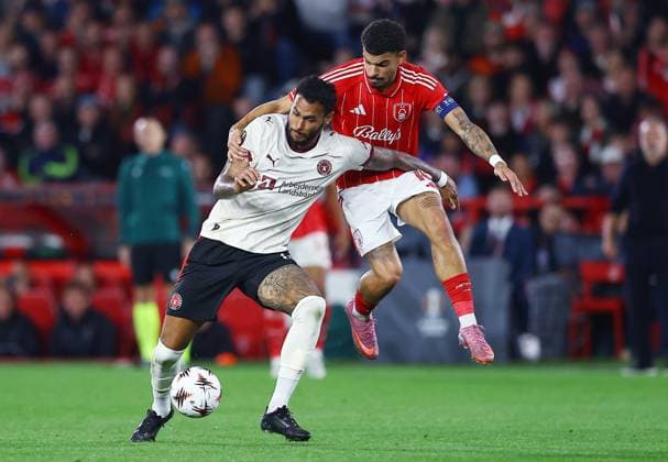 Junior Brumado of FC Midtjylland and Morgan Gibbs-White of Nottingham Forest Nottingham Forest v Midtjylland, UEFA Europa League, Group Stage, Football, City Ground, Nottingham, UK - 02 Oct 2025Nottingham City Ground United Kingdom EDITORIAL USE ONLY No use with unauthorised audio, video, data, fixture lists, club league logos or live services. Online in-match use limited to 120 images, no video emulation. No use in betting, games or single club league player publications. Copyright: xMattxWest Shutterstockx 15504058ak
