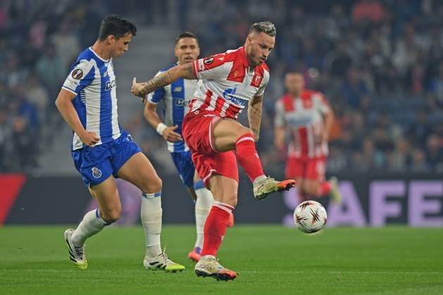2nd October 2025; Dragao Stadium, Porto, Portugal: UEFA Europa League 2025 2026, FC Porto versus Red Star Belgrade; Dominik Prpic of FC Porto with Marko Arnautovic of Red Star Belgrade  DanielxCastro