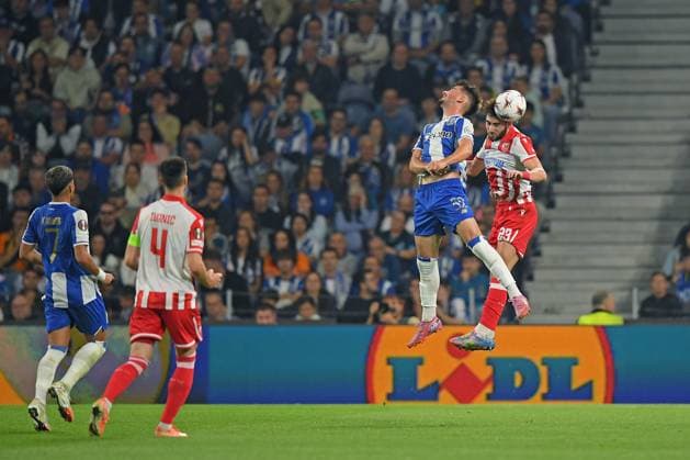 2nd October 2025; Dragao Stadium, Porto, Portugal: UEFA Europa League 2025 2026, FC Porto versus Red Star Belgrade; Martim Fernandes of FC Porto and Nayair Tiknizyan of Red Star Belgrade challenge for a header  DanielxCastro