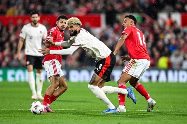 2nd October 2025; The City Ground, Nottingham, England; UEFA Europa League Football, Nottingham Forest versus Midtjylland; Philip Billing of FC Midtjylland goes down after a challenge from Dan Ndoye of Nottingham Forest as Morgan Gibbs-White of Nottingham Forest watches the ball  GodfreyxPitt