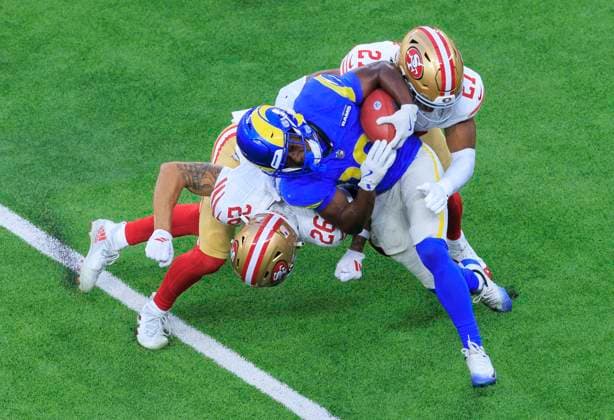October 2, 2025, Inglewood, California, USA: 26 Chase Lucas, CB and 27 Jiâ€⠢Ayir Brown, SAF of the San Francisco 49ers tackle 19 Xavier Smith, WR of the Los Angeles Rams during their regular NFL, American Football Herren, USA season game on Thursday October 2, 2025 at SoFi Stadium in Inglewood, California. Rams lose to 49ers, 23-26. ARIANA RUIZ PI Inglewood USA - ZUMAp124 20251002_zaa_p124_072 Copyright: xArianaxRuizx