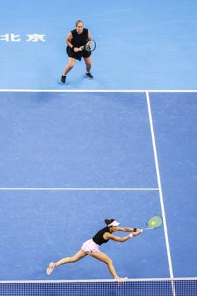 BEIJING, CHINA - OCTOBER 03: Hsieh Su-wei of Chinese Taipei and Jelena Ostapenko of Latvia compete in the Women s Doubles Quarterfinal match against Tereza Mihalikova of Slovakia and Olivia Nicholls of Great Britain on day 12 of the 2025 China Open at the National Tennis Center on October 3, 2025 in Beijing, China.  Copyright: xVCGx 111594807278