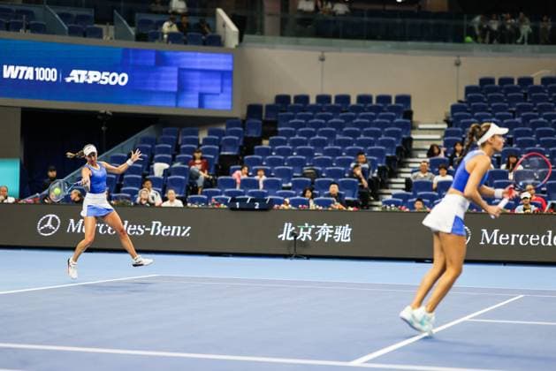 BEIJING, CHINA - OCTOBER 03: Tereza Mihalikova of Slovakia and Olivia Nicholls of Great Britain compete in the Women s Doubles Quarterfinal match against Hsieh Su-wei of Chinese Taipei and Jelena Ostapenko of Latvia on day 12 of the 2025 China Open at the National Tennis Center on October 3, 2025 in Beijing, China.  Copyright: xVCGx 111594807675