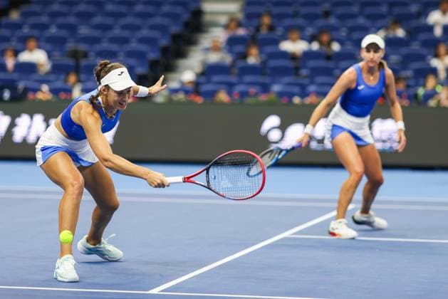 BEIJING, CHINA - OCTOBER 03: Tereza Mihalikova of Slovakia and Olivia Nicholls of Great Britain compete in the Women s Doubles Quarterfinal match against Hsieh Su-wei of Chinese Taipei and Jelena Ostapenko of Latvia on day 12 of the 2025 China Open at the National Tennis Center on October 3, 2025 in Beijing, China.  Copyright: xVCGx 111594809716