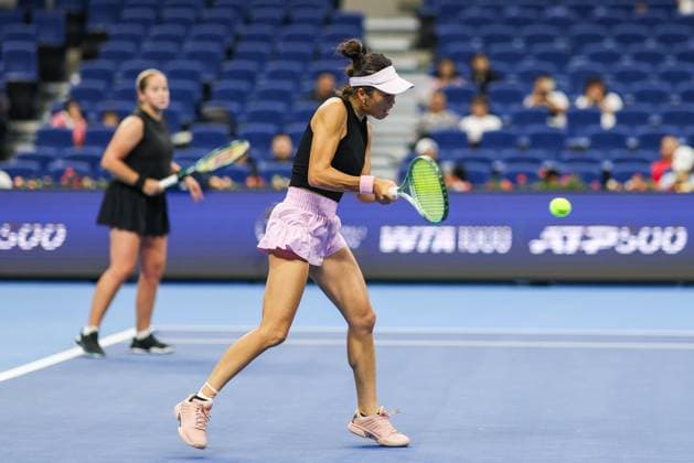 BEIJING, CHINA - OCTOBER 03: Hsieh Su-wei of Chinese Taipei and Jelena Ostapenko of Latvia compete in the Women s Doubles Quarterfinal match against Tereza Mihalikova of Slovakia and Olivia Nicholls of Great Britain on day 12 of the 2025 China Open at the National Tennis Center on October 3, 2025 in Beijing, China.  Copyright: xVCGx 111594804843