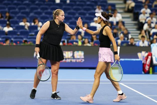 BEIJING, CHINA - OCTOBER 03: Hsieh Su-wei of Chinese Taipei and Jelena Ostapenko of Latvia react in the Women s Doubles Quarterfinal match against Tereza Mihalikova of Slovakia and Olivia Nicholls of Great Britain on day 12 of the 2025 China Open at the National Tennis Center on October 3, 2025 in Beijing, China.  Copyright: xVCGx 111594804859