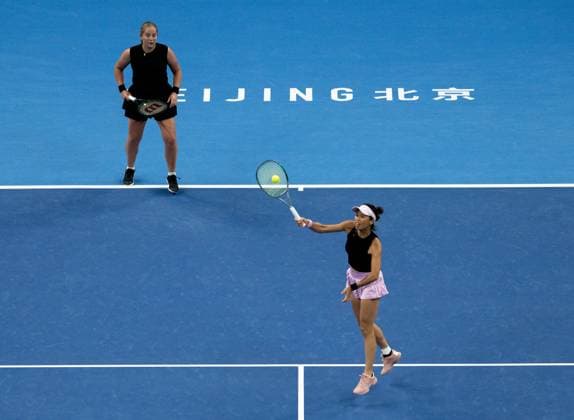 (251003) -- BEIJING, Oct. 3, 2025 -- Hsieh Su-Wei (R) Jelena Ostapenko compete during the women s doubles quarterfinal match between Hsieh Su-Wei (Chinese Taipei) Jelena Ostapenko (Latvia) and Tereza Mihalikova (Slovakia) Olivia Nicholls (Britain) at 2025 China Open tennis tournament in Beijing, China, Oct. 3, 2025. ) (SP)CHINA-BEIJING-TENNIS-CHINA OPEN-WOMEN S DOUBLES-QUARTERFINAL (CN) HuxJingwen 